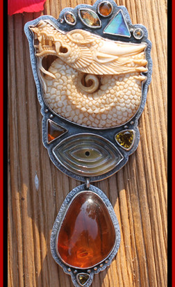 Balinese Hand-Carved Bone Dragon with Large Piece of Russian Amber, Faceted Golden Citrine, New Zealand Paua Shell and an Eye carved in Mother of Pearl to "Ward Off Evil."